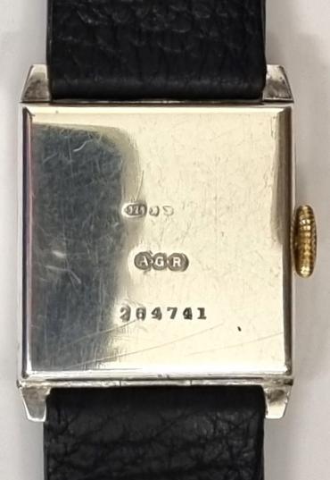 Swiss Officers style manual wind tank watch in a silver case with import hallmark for Edinburgh 1929 on a black leather strap with silvered buckle. Silvered dial with black hours and minute track with blued steel hands and subsidiary seconds dial. Unsigned 15 jewel engine turned decorated movement with case back stamped 'A.G.R' and numbered 264741.