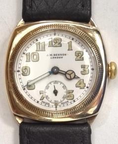 Swiss made J.W.Benson hand wind wrist watch in a 9ct gold case made by Francois Borgel and with Glasgow import hallmark for c1932 on a brown leather strap with gilt buckle. Signed white dial with black luminous infilled numeric hours and matching hands with subsidiary seconds dial. Swiss Cyma calibre 010 adjusted 16 jewel jewelled lever movement with split bi-metallic balance and overcoil hairspring and numbered 582272 with 'SFC' case back numbered 0169984..