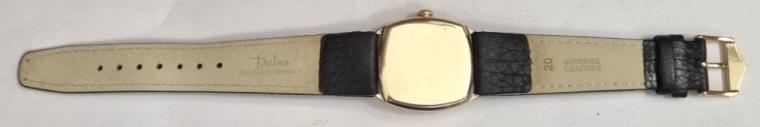 Swiss made J.W.Benson hand wind wrist watch in a 9ct gold case made by Francois Borgel and with Glasgow import hallmark for c1932 on a brown leather strap with gilt buckle. Signed white dial with black luminous infilled numeric hours and matching hands with subsidiary seconds dial. Swiss Cyma calibre 010 adjusted 16 jewel jewelled lever movement with split bi-metallic balance and overcoil hairspring and numbered 582272 with 'SFC' case back numbered 0169984.
