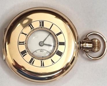 Swiss made Rolex half hunter pocket watch in an English 9ct gold case with top wind and time change and hallmarked for Chester c1927. Black Roman hours on the outer case and internal white enamel dial with black numeric hours and blued steel hands with a subsidiary seconds dial at 6 o/c. Swiss made signed Rolex jewelled lever movement with split bi-metallic balance and overcoil hairspring with engine turned decoration with case back numbered 8693.