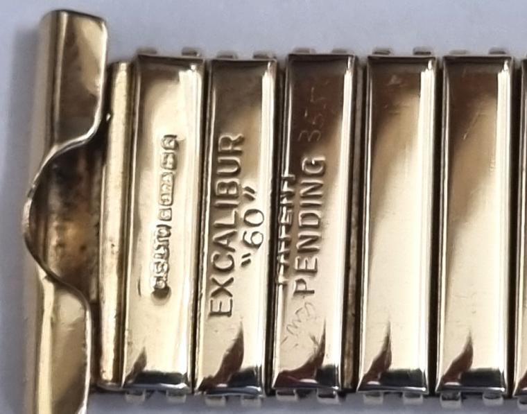 Excalibur "60" solid 9ct gold expanding watch bracelet, hallmarked for Birmingham c1965, very little usage near mint condition.   Length 152mm, width fitting 18mm, weight 30 grams.