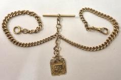 9ct gold graduated double albert with 'T' bar, one snap and split ring with 9ct gold fob hallmarked for Birmingham c1910. Length 18", weight 44 grams.