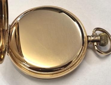 American Waltham Watch Co., full hunter pocket watch in a 9ct gold Dennison case numbered 334564 and hallmarked for Birmingham c1925. Top wind and time change with plain outer case over a signed white enamel dial with black Roman hours and blued steel hands with a subsidiary seconds dial at 6 o/c. American Waltham 15 jewel jewelled lever movement with split bi-metallic balance and overcoil hairspring and numbered 24185261.