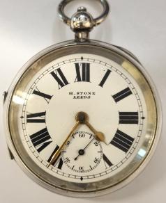 English silver cased full plate lever pocket watch by H.Stone of Leeds in a Dennison case hallmarked for Birmingham c1909 and numbered 24663. Key wind and time change with signed white enamel dial with black Roman hours and gilt hands with subsidiary seconds dial. Back plate signed and numbered 39702 with full plate lever movement with plain cock piece and split bi-metallic jewelled balance. Case Diameter - 58mm.