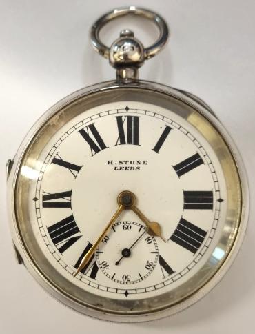 English silver cased full plate lever pocket watch by H.Stone of Leeds in a Dennison case hallmarked for Birmingham c1909 and numbered 24663. Key wind and time change with signed white enamel dial with black Roman hours and gilt hands with subsidiary seconds dial. Back plate signed and numbered 39702 with full plate lever movement with plain cock piece and split bi-metallic jewelled balance. Case Diameter - 58mm.