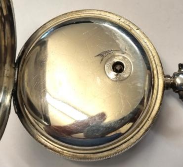English full plate lever pocket watch by Arthur Dickinson of Market Place, Selby in a silver case hallmarked for Chester c1898 and numbered 77519. Key wind and time change with signed white enamel dial with black Roman hours and gilt hands with subsidiary seconds dial. Back plate signed and numbered 77519 with full plate lever movement with plain cock piece and split bi-metallic jewelled balance. Case Diameter - 54mm.