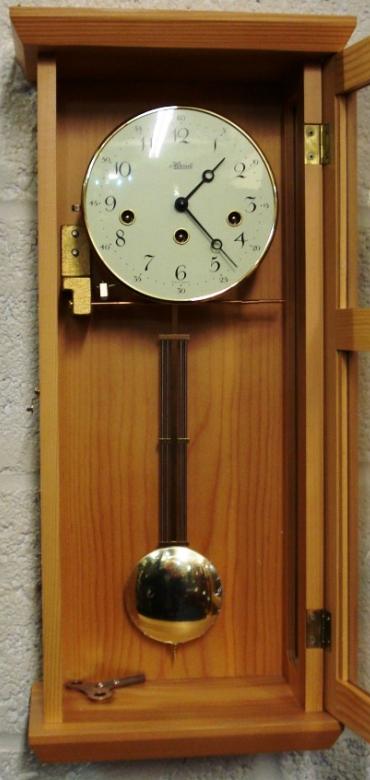 Brand new pine cased 8 day spring driven Westminster chiming pendulum wall clock by Franz Hermle & Son. Case height - 22".
