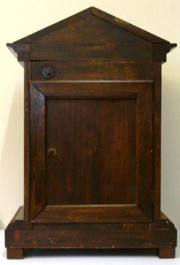 German oak cased 8 day Westminster chime bracket clock by Junghans circa 1900. Architectural case with carved decorated top and plinth, with wooden ball feet. Carved wooden door with heavily chamfered glass over acid etched brass dial plate with Chime / Silent and Slow / Fast controls at the top. White silvered chapter ring with black roman hours and ornate blued steel hands. Square brass spring driven, pendulum regulated movement, stamped with the Junghans touch mark.