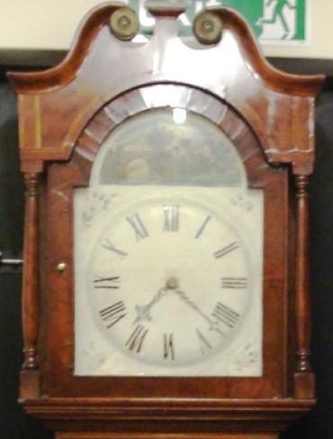 Clock for sale for restoration. English 30 hour oak and mahogany cased bell striking long case grandfather clock. Scrolling swan neck topped case with turned side columns, original glass over a aged painted dial, black roman hours and brass hands. Lacks pendulum and weight.