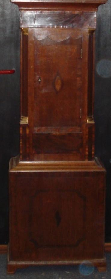 Clock for sale for restoration:- English 8 day oak and mahogany cased bell striking longcase grandfather clock by W. Evans of Shrewsbury circa 1820. Scrolling swan neck pediment with cross banding and shell motif inlay together with  fluted brass capped side columns. Original glass over painted and gilded dial with floral decoration and black roman hours, date aperture and seconds dial. Lacks minute and seconds hands, weights and pendulum.