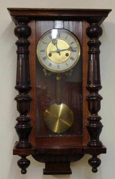Clock for sale for restoration:- Vienna Regulator style stained pine cased gong striking wall clock by H.A.C. Flat top pediment, full length door with turned side columns, original glass over white dial with black roman hours, ornate blued steel hands. Standard brass spring driven pendulum regulated 8 day movement circa 1900. Back plate displays the H.A.C. crossed arrows mark. Lacks crest and some finials.
