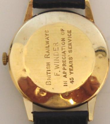 Bernex 9ct gold wrist watch with Bernex signed manual wind swiss incabloc 17 jewel movement, on a black leather strap. Silver coloured dial with gilt arabic hour markers and matching gilt hands with subsidiary seconds dial at 6 o/c. The case back records the presentation to F.Winder by British Railways in appreciation for 45 years service and is stamped DS&S and numbered 05013 and bears the mark for Girard Perregaux 1791.
