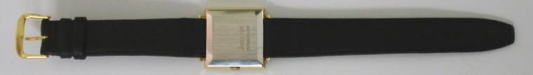 Accurist Shockmaster manual wind wrist watch in a square gold plated case with stainless steel back, on a black leather strap with gilt buckle. Brushed gilt dial with gilt baton hour markers and matching hands, date display at 3 o/c. Signed swiss Peseux calibre 7046 21 jewel incabloc movement.
