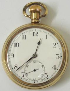 Swiss Revue gold plated pocket watch in a Dennison case, white enamel dial, black arabic hours, black steel hands, subsidiary seconds dial.