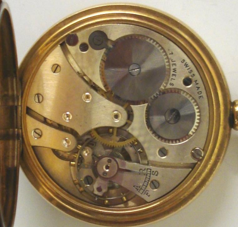 Swiss Revue pocket watch in a Dennison gold plated case with top wind and time change. White enamel dial with black arabic hours and blued steel hands and subsidiary seconds dial at 6 o/c. Swiss manual wind lever movement with 7 jewels, the Dennison watch case back numbered #221208.