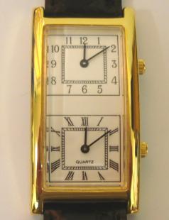modern quartz dual time display wrist watch in gold plated case with stainless steel back