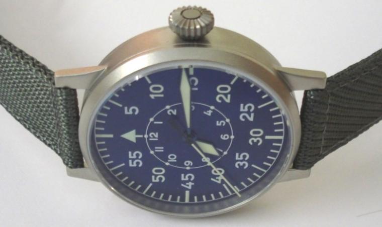 New German Laco Flieger Leipzig FL23883 manual wind wrist watch in an All Stainless Steel case with grey nylon strap with steel buckle. Sapphire crystal over a radiant blue dial with luminous arabic outer minute track and inner hours ring. Blue edged hands with luminous inserts and sweep seconds hand. Large button crown and engraved back over a Swiss ETA 2801.2 movement, case water resistant to 5 ATM. Brand new watch with all box and paperwork and 2 year manufacturers guarantee.