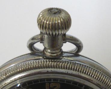 Elgin National Watch Co. WW2 military pocket watch. Black enamel dial with old luminous arabic hours, matching hands and subsidiary seconds dial at 6 o/c. Base metal case with screw on front and back with 9 jewel jewelled lever movement numbered #41230358 and dating from 1943. The case back is worn but bears the broad arrow mark and is numbered A97134.