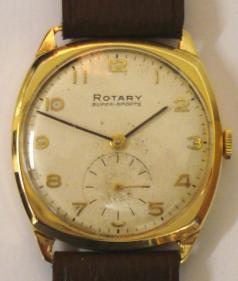 Rotary Super Sports manual wind wrist watch in a 9ct gold case on a brown leather strap. Matt white dial with gilt arabic hour markers and black and gilt hands and subsidiary seconds dial. Rotary 505 Peseux calibre 330 15 jewel movement with iron ore cover in a Dennison case numbered #13102 and #93476 and hallmarked for Birmingham 1960.