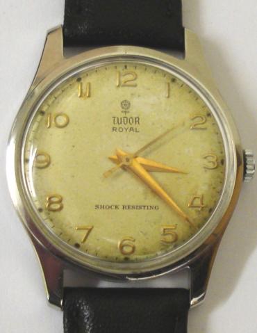 Gents Tudor Royal manual wind wrist watch in a stainless steel Dennison (For Rolex) 'Denisteel' case on a black leather strap with silver buckle. Discoloured silvered dial with gilt arabic hour markers, gilt hands and a sweep seconds hand. Swiss made 17 jewel signed Tudor movement with case back numbered #12879 and #7843.