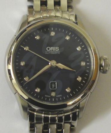 Oris 7604 Artelier All Stainless Steel ladies mid size automatic wrist watch in a stainless steel case with integral bracelet. Sapphire crystal over a black textured dial set with diamond hour markers with silvered hands and sweep seconds hand and date display at 6 o/c. Swiss made Oris High Mech automatic movement with screw on case back, numbered 28-61535, water resistant to 30 metres.