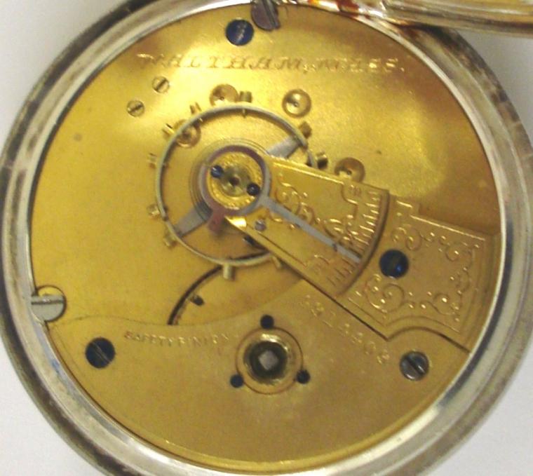 American A.W.W & Co Waltham nickel cased open face pocket watch with key wind and time change. White enamel dial with black roman hours, blued steel hands and subsidiary seconds dial. Signed Waltham jeweled lever safety pinion movement with split bi-metallic balance and numbered #4914409 with case number #679.