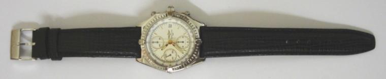 Breitling Automatic Chronograph in a stainless steel case on an original black leather strap. Sapphire crystal over a white dial with gilt and luminous baton hour markers and matching hands with a subsidiary seconds dial and date display at 3 o/c. 12 hour chronograph time recording via the sweep seconds hand and subsidiary hours and minutes dials. Screw down crown and case back with signed 25 jewel calibre 7750 Valjoux movement.