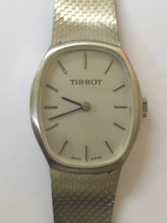 Tissot manual wind wrist watch housed in a stainless steel case with integral stainless steel adjustable bracelet. Brushed silver dial with polished silver and black hour markers and matching black hands. Signed Tissot calibre 2180 jewel lever incabloc movement numbered #21141 with signed case back numbered #10933.