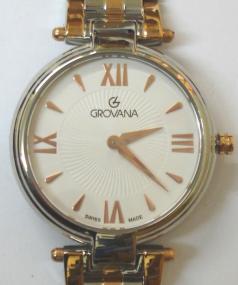 Brand new mid-size quartz wrist watch by Grovana in an all stainless steel case with integral two colour bracelet. Sapphire crystal over a white textured dial with polished gilt hours and matching hands. Brand new model 4576.1LE watch number 1152 water resistant to 30 metres complete with box, all paperwork and manufacturer's guarantee.