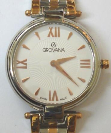 Brand new mid-size quartz wrist watch by Grovana in an all stainless steel case with integral two colour bracelet. Sapphire crystal over a white textured dial with polished gilt hours and matching hands. Brand new model 4576.1LE watch number 1152 water resistant to 30 metres complete with box, all paperwork and manufacturer's guarantee.