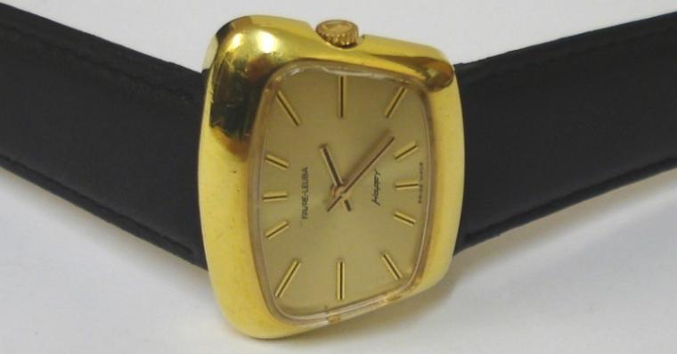 Gents Swiss Favre Leuba 'Happy' manual wind wrist watch in a gold plated case on a black leather strap with gilt buckle. Gilt sunburst dial with gilt and black baton hour markers and matching hands. Signed 17 jewel FHF69 calibre movement with case back numbered #54612.