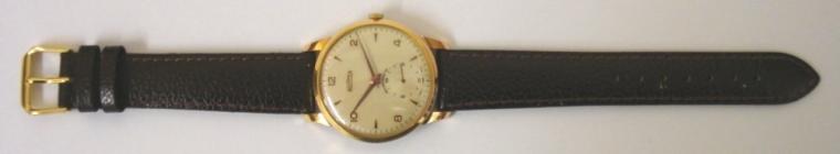 Swiss Roamer manual wind wrist watch on a brown leather strap with gilt buckle. Gold plated case with stainless steel back numbered #6841 with silvered dial. Gilt Arabic and dart hour markers with matching hands and subsidiary seconds dial. Signed Swiss 15 jewel jewelled lever movement calibre MST402.