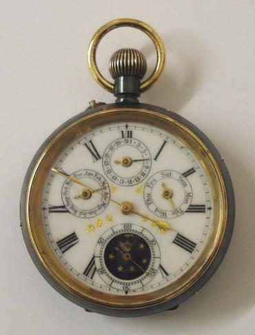 Swiss Full Calendar pocket watch in a blued steel case with top wind and rocking bar time change c1890. White enamel dial showing slight defects, black Roman hours with gilt hands and subsidiary seconds dial. Additional subsidiary dials displaying Day, Date and Month with Moon Phase indicator within the seconds dial. Swiss jewelled lever split bar movement with bi-metallic balance and numbered 11,170 and 9835.