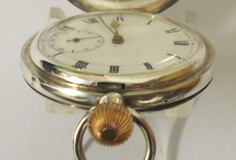 Swiss 'The Spartan' silver cased full hunter pocket watch with top wind and time change. White enamel dial with black Roman hours, gilt hands and subsidiary seconds dial. 7jewel jewelled lever movement with bi-metallic balance and overcoil hairspring. The London import case is numbered #167475 and is hallmarked for circa 1918.