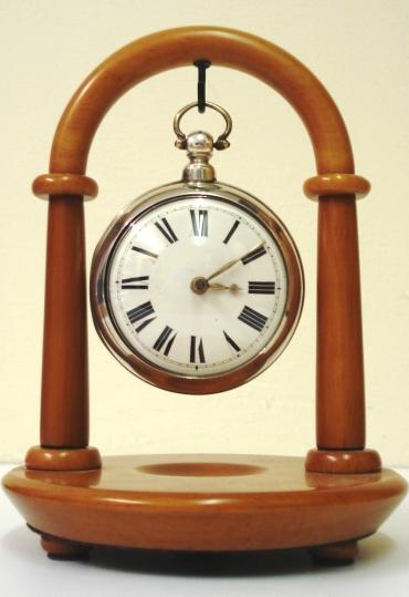 Modern wooden pocket watch stand by the 'Rapport' company. Available in both light and dark brown and black.