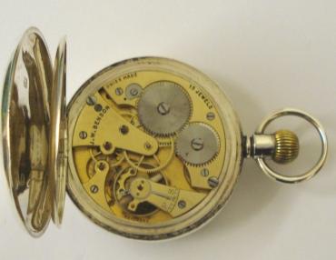 Swiss silver cased pocket watch with London hallmark for 1936 by J.W.Benson. Top wind and time change with white enamel dial and black Roman hours with blued steel hands and a subsidiary seconds dial. Signed 15 jewel lever movement reference 9398, case numbered #655245.
