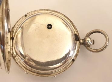English silver cased pocket watch manufactured by Newsome and Co. and retailed by Ezra L.Feldman of Cheltenham. Key wind and time change with white enamel dial and black Roman hours with gilt spear and shaft hands and subsidiary seconds dial, the silver case hallmarked for London circa 1888. Fusee movement with floral decorated cock piece and jewelled end stone signed for Ezra Feldman and stamped for Newsome and Co. beneath the dial plate with #98303 numbering throughout.