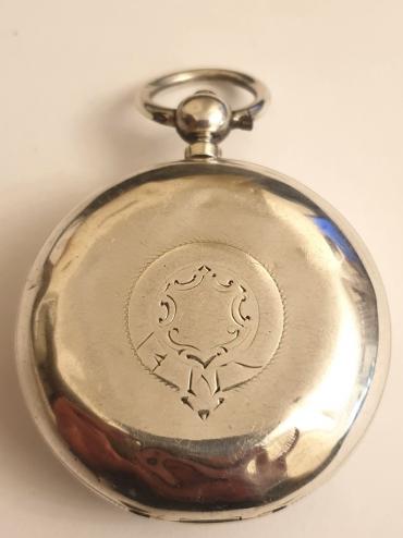 American Watch Co. Waltham lever pocket watch in a silver case with Birmingham hallmark for 1883, case numbered #55528 and 'AB'. Key wind and time change with signed white enamel dial and black Roman hours with gilt hands and subsidiary seconds dial. Back plate signed and numbered #2463341 with engraved cock piece and jewelled end stone.