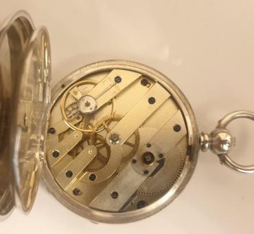 Swiss silver cased pocket watch late C19th, maker unknown. Key wind and time change with white enamel dial and black Roman hours with gilt hands, the engine decorated silver case numbered #12013 with initials 'EG'. Undecorated split bar movement with cylinder escapement and jewelled balance.