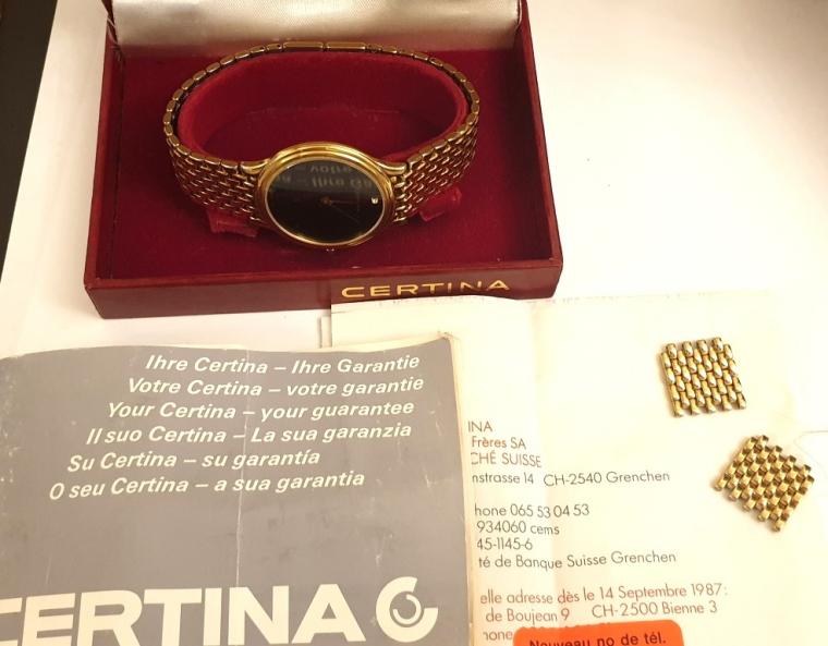 Modern Swiss quartz dress watch by Certina. Gold plated case over stainless steel with matching integral bracelet and a stainless steel back. Sapphire crystal over a matt black dial precious gem set at 12 o/c with polished gilt angular pointed hands, case water resistant to 50m. and complete with original retail box and papers.