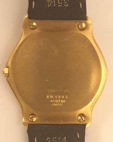 Gents Swiss made Ebel quartz wrist watch in an 18K gold case with leather strap and 18K gold deployment buckle. Black dial with polished gilt hands and matching Roman hour markers.