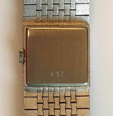 Ladies Swiss Rotary manual wind 1950s wrist watch in a bark effect white metal case with integral bracelet circa 1970. Signed silvered dial with polished baton hours with black inserts and matching hands. Swiss made 17 jewel jewelled lever movement with stainless steel back numbered 637.