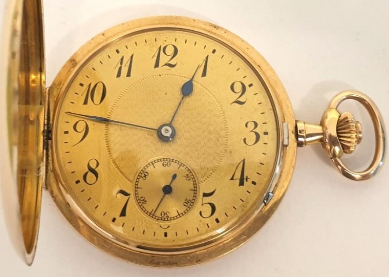 Swiss full hunter pocket watch in a 14ct gold case signed Haefliger Freres, Lucerne and c1900, with top wind and rocking bar time change. Outer case with monogram over a gilt dial with engine turned centre, black Arabic hours, blued steel hands and subsidiary seconds dial at 6 o/c. Jewelled lever movement with bi-metallic balance, gold case with 'ACD' maker's mark and numbered 112326.
