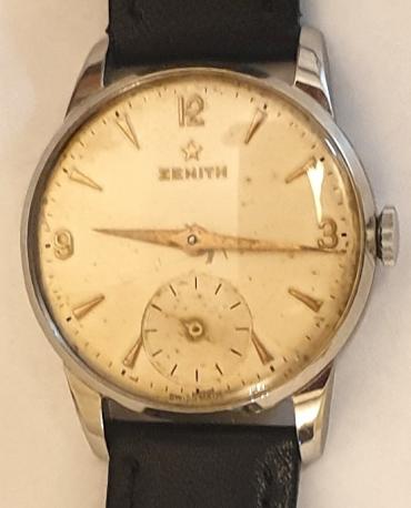 Swiss Zenith midsize manual wind wrist watch in stainless steel case on a black leather strap with silvered buckle. Signed silvered dial with polished gilt Arabic and dart hours with matching hands and a subsidiary seconds dial at 6 o/c. Signed Swiss Zenith calibre 40 gilt finished 17 jewel jewelled lever movement numbered 4838481.