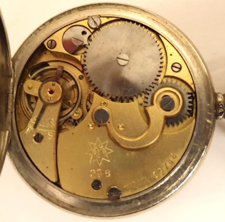 German WWII single push piece pocket stop watch by Junghans in a nickel case. Crown operated wind and single push stop watch function with signed white dial and black Arabic outer seconds register with 30 minute time recording subsidiary dial. Junghans calibre 29a movement with jewelled lever escapement and numbered 19748.