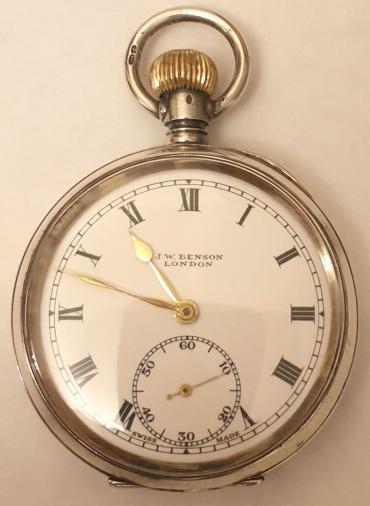 Swiss J.W.Benson pocket watch in a silver case with a London import hallmark for 1919. Top wind and time change with white enamel J.W.Benson, London signed dial with black Roman hours and gilt hands with subsidiary seconds dial at 6 o/c. Swiss 15 jewel jewelled lever escapement with bi-metallic balance in a .925 silver case numbered 1880.