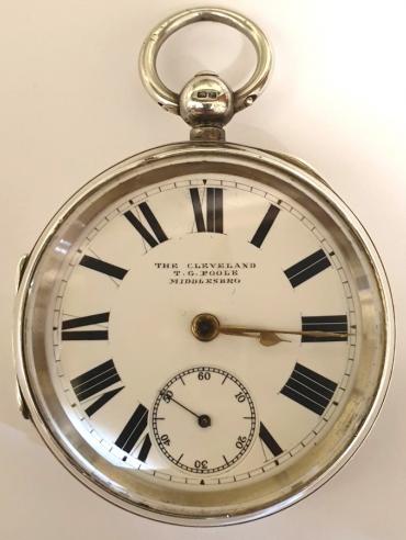 English silver cased pocket watch 'The Cleveland' by The Lancashire Watch Co., retailed by T.G. Poole, Middlesbro, the 'TPH' case hallmarked for Chester 1895 and numbered 12697. Key wind and time change with retailer signed white enamel dial with black Roman hours and gilt hands and subsidiary seconds dial. Back plate signed T. Gibson Poole and numbered 198161 with decorated cock piece, going barrel movement with split bi-metallic jewelled balance.