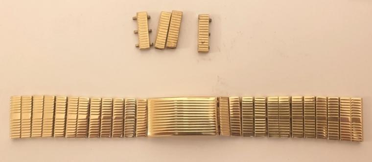 Solid 9ct gold wrist watch bracelet hallmarked for Birmingham 1960 with additional spare links.    Length 145mm, to fit 18mm lugs, weight 46 grams.