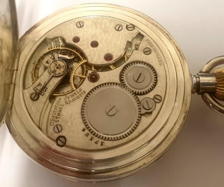 Swiss half hunter pocket watch by the Rode watch company in a silver case with top wind and time change. External black Roman hours on the outer case and internal white enamel dial with black Roman hours and blued steel hands with subsidiary seconds dial at 6 o/c. Swiss signed 'Rode' 17 jewel jewelled lever movement adjusted to three positions and numbered 17584, with overcoil hair spring and split bi-metallic balance. The silver casework bearing a London import hallmark for c1922 and numbered 155638.