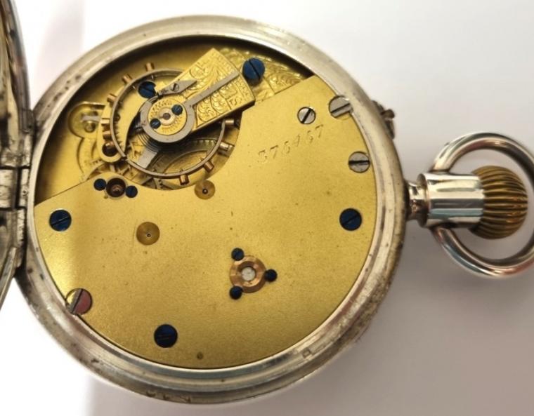 English silver cased pocket watch by John Dyson & Sons of Leeds in original plush velvet lined presentation box. Top wind and pin set rocking bar time change. White enamel dial with black Roman hours and blued steel hands with a subsidiary seconds dial at 6 o/c. 3/4 plate jewelled lever movement with going barrel numbered 375457 with silver case hallmarked for Birmingham c1910 and numbered 76760.